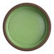 A round, green stoneware tray with a brown rim.