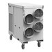 A large industrial heat pump unit with three circular air vents and caster wheels for mobility.