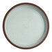 A round, stackable deep stoneware tray with a speckled light interior and a brown rim.