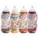 A set of four Smucker's Platescapers dessert topping bottles in chocolate, vanilla, caramel, and raspberry flavors.