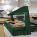 A green Cambro Buffet / Salad Bar with food containers.