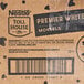 A box of Nestle Toll House Premier White Morsels weighing 25 pounds.