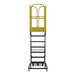 A seven-step extra heavy-duty rolling safety ladder with a yellow safety rail and serrated tread steps.