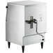 A stainless steel undercounter flake ice machine with a power cord and adjustable legs.