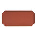 A rectangular faux leather amenity tray in a canyon orange color.