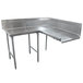 A stainless steel L-shape dishtable with two legs on a counter.