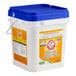 A large white plastic container of Arm & Hammer 18 lb. Free & Clear powder detergent with a blue lid and carrying handle.