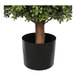 An artificial potted boxwood ball topiary with a black pot.