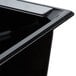 A Vollrath black plastic food pan with a lid.