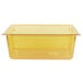 A Vollrath amber plastic food pan with a lid.