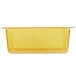 A yellow Vollrath plastic food pan with a white border.