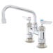 A T&S chrome deck-mount sink faucet with two handles.
