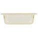 A Vollrath 1/3 size amber plastic food pan with a clear lid.