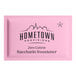 A pink packet of Hometown Provisions zero calorie saccharin sweetener.