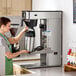 A commercial Bunn Infusion Series Platinum Pro ITCB-DV HV automatic coffee and tea brewer with a stainless steel finish.