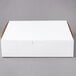 A plain white, rectangular bakery box with a closed lid.