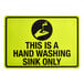A yellow and black safety decal sign that reads 'This Is A Hand Washing Sink Only' with a hand and faucet graphic.