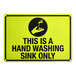 A yellow and black reflective aluminum safety sign that reads 'This Is A Hand Washing Sink Only' with a hand washing symbol.