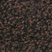 A close-up of a brown and black textured floor mat with a plush surface.
