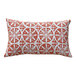 A rectangular lumbar pillow with a rust and white circular geometric pattern.