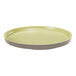 A round, green melamine plate that can also be used as a bento box lid.