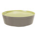 A round green melamine plate that also functions as a lid for a bento box.