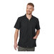 A men's black short-sleeve full-zip service or housekeeping shirt with two front pockets, shown in extra large size.