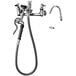 A T&S chrome wall mount pot and kettle filler faucet with hose and hook nozzle.