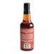 A 10 fl. oz. bottle of Merchants Exchange Orange Bitters with a black cap and red label.