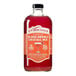A 750 mL bottle of Stirrings Blood Orange Cocktail Mix.