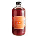 A 750 mL bottle of Stirrings Blood Orange Cocktail Mix.