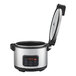 A stainless steel electric rice cooker and warmer with a digital control panel and an open lid.