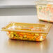 A Vollrath high heat plastic slotted lid on a plastic container of food with carrots.