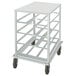 A white metal cart with black wheels.