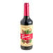 A 750 mL glass bottle of Torani Puremade Forest Pine flavoring syrup.