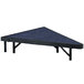 A blue carpeted triangular platform with black base.