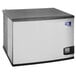 A commercial Manitowoc air-cooled full dice cube ice machine with a stainless steel exterior.