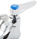 A chrome T&S wall mount faucet with lever handles.
