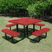 A square red perforated metal picnic table with attached benches and black metal legs, designed for outdoor use.