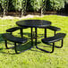 A round black perforated metal picnic table with four attached curved benches.