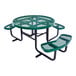 A round green expanded metal picnic table with attached curved benches and black metal legs.