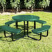 A round green perforated metal picnic table with attached curved benches.