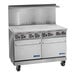 An industrial stainless steel electric range with eight wafer plates, two standard ovens, and a backsplash, designed for commercial kitchens.