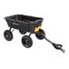 A heavy-duty black poly yard dump cart with four wheels and a pull handle.