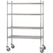 A chrome plated Advance Tabco mobile wire shelving unit with rubber swivel casters.