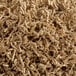 A pile of brown kraft crinkle paper shred used for packaging or gift baskets.