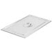 A Vollrath stainless steel lid on a tray.