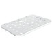 A stainless steel metal plate with holes.