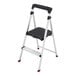 A two-step aluminum folding step stool with a black handle and wide top platform.