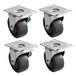 A set of 4 Beverage-Air black rubber plate casters with steel plates.